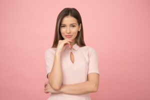 a woman stands looking at the camera, lifestyle and fertility 