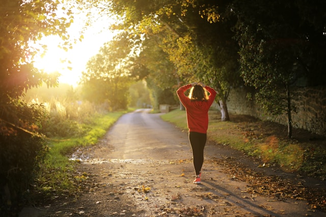 Woman walking in the sunlight thinking about her fertility journey. Brookfield chiropractic, fertility, infertility. 