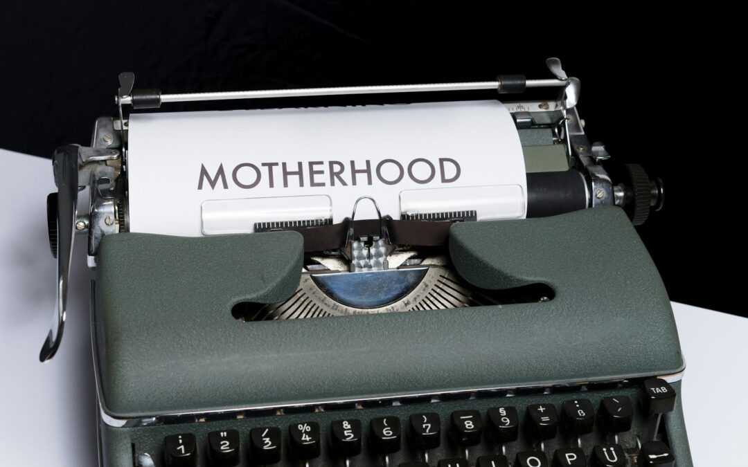 Black typewriter that is spelling out motherhood