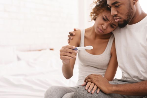 A couple struggling with the pressures of infertility