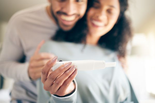 Happy man and woman after battling infertility